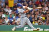Toronto Blue Jays' Davis Schneider hits a one-run double allowing Kazuma Okamoto to score in the sixth inning of a baseball game against the Boston Red Sox, Tuesday, June 16, 2026, in Boston. (AP Photo/Steven Senne)