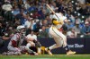 Milwaukee Brewers' Garrett Mitchell hits a solo home run during the seventh inning of a baseball game against the Cleveland Guardians, Tuesday, June 16, 2026, in Milwaukee. (AP Photo/Aaron Gash)