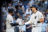 New York Yankees pitcher Spencer Jones, right, celebrates a solo home run during the first inning of a baseball game against the Chicago White Sox, Tuesday, June 16, 2026, in New York. (AP Photo/Eduardo Munoz Alvarez)