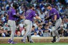 Colorado Rockies' TJ Rumfield, right, celebrates with Willi Castro, left, and Hunter Goodman after hitting a two-run home run during the fourth inning of a baseball game against the Chicago Cubs in Chicago, Tuesday, June 16, 2026. (AP Photo/Nam Y. Huh)