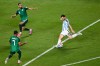 Argentina's Lionel Messi (10) shoots and scores their third goal against Algeria's Riyad Mahrez (7) and Nabil Bentaleb (19) during the World Cup Group J soccer match between Argentina and Algeria in Kansas City, Mo., Tuesday, June 16, 2026. (AP Photo/Reed Hoffmann)
