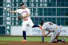 Detroit Tigers' Wenceel Perez, right, is out at second base as Houston Astros second baseman Jose Altuve, left, attempts a double play during the fifth inning of a baseball game, Tuesday, June 16, 2026, in Houston. (AP Photo/Michael Wyke)