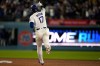 Los Angeles Dodgers' Shohei Ohtani gestures as he rounds second after hitting a solo home run during the sixth inning of a baseball game against the Tampa Bay Rays, Tuesday, June 16, 2026, in Los Angeles. (AP Photo/Mark J. Terrill)