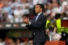 FILE - Then-Rangers' head coach Giovanni van Bronckhorst claps his hands during the Europa League final soccer match between Eintracht Frankfurt and Rangers FC at the Ramon Sanchez Pizjuan stadium in Seville, Spain, May 18, 2022. (AP Photo/Manu Fernandez, File)