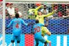 Congo's Yoane Wissa (20) scores his side's first goal against Portugal goalkeeper Diogo Costa during the World Cup Group K soccer match between Portugal and Congo in Houston, Wednesday, June 17, 2026. (AP Photo/Karen Warren)