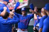 New York Mets' Juan Soto celebrates with his teammates after scoring on an RBI single by Mark Vientos during the third inning of a baseball game against the Cincinnati Reds in Cincinnati, Wednesday, June 17, 2026. (AP Photo/Ben Jackson)