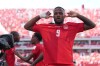 Canada's Cyle Larin (9) celebrates after scoring his sides first goal of the game in the second half of the World Cup Group B soccer match between Canada and Bosnia, Friday, June 12, 2026, in Toronto. (AP Photo/Sam Balkansky)