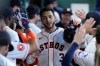 Houston Astros' Jeremy Peña is congratulated in the dugout after hitting a solo home run during the third inning of a baseball game against the Detroit Tigers, Wednesday, June 17, 2026, in Houston. (AP Photo/Kevin M. Cox)
