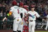 Arizona Diamondbacks' Corbin Carroll celebrates with Ketel Marte (4) and Geraldo Perdomo (2) after hitting a grand slam against the Los Angeles Angels in the second inning of a baseball game, Wednesday, June 17, 2026, in Phoenix. (AP Photo/Rick Scuteri)