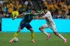 Colombia's Luis Diaz (7) battles for the ball with Uzbekistan's Abdukodir Khusanov (2) during the World Cup Group K soccer match between Uzbekistan and Colombia in Mexico City, Wednesday, June 17, 2026. (AP Photo/Fernando Llano)
