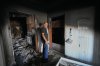 Resident Samih Haidar reacts as he inspects his burned apartment damaged in Israeli strikes in the southern port city of Tyre, Lebanon, Thursday, June 18, 2026. (AP Photo/Hassan Ammar)