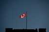 The flag flies over the Prime Minister's Office near Parliament Hill in Ottawa on Wednesday, Jan. 15, 2025. THE CANADIAN PRESS/Spencer Colby