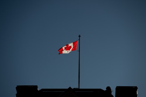 The flag flies over the Prime Minister's Office near Parliament Hill in Ottawa on Wednesday, Jan. 15, 2025. THE CANADIAN PRESS/Spencer Colby