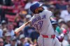 Toronto Blue Jays' Vladimir Guerrero Jr. watches the flight of his fly out during the eighth inning of a baseball game against the Boston Red Sox's, Thursday, June 18, 2026, in Boston. (AP Photo/Charles Krupa)