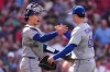 Toronto Blue Jays catcher Brandon Valenzuela, left, congratulates Mason Fluharty after defeating the Boston Red Sox following a baseball game against the Boston Red Sox, Thursday, June 18, 2026, in Boston. (AP Photo/Charles Krupa)