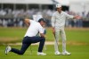 Miles Russell and Padraig Harrington, of Ireland, talk on the fourth hole during the first round of the U.S. Open golf tournament at Shinnecock Hills Golf Club in Southampton, N.Y., Thursday, June 18, 2026.(AP Photo/Seth Wenig)