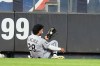 Chicago White Sox's Everson Pereira (28) runs into the wall to catch a ball hit by New York Yankees' Ben Rice for an out during the seventh inning of a baseball game Wednesday, June 17, 2026, in New York. (AP Photo/Frank Franklin II)