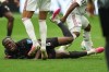 Canada's Ismael Kone falls while sustaining an injury during the World Cup Group B soccer match against Qatar in Vancouver, British Columbia, Thursday, June 18, 2026. (AP Photo/Abbie Parr)