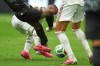 Canada's Ismael Kone, left, falls while being fouled against by Qatar's Assim Madibo during the World Cup Group B soccer match in Vancouver, British Columbia, Thursday, June 18, 2026. (AP Photo/Abbie Parr)