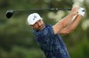 Dustin Johnson watches his tee shot on the sixth hole during the first round of the U.S. Open golf tournament at Shinnecock Hills Golf Club in Southampton, N.Y., Thursday, June 18, 2026.(AP Photo/Seth Wenig)