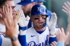 Kansas City Royals' Bobby Witt Jr. (7) celebrates in the dugout after hitting a solo home run during the first inning of a baseball game against the St. Louis Cardinals, Thursday, June 18, 2026, in Kansas City, Mo. (AP Photo/Charlie Riedel)