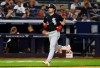 Chicago White Sox's Andrew Benintendi rounds the bases after hitting a grand slam against the New York Yankees during the eighth inning of a baseball game, Thursday, June 18, 2026, in New York. (AP Photo/Noah K. Murray)