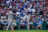 New York Mets' Juan Soto, right, celebrates with third base coach Tim Leiper after hitting a home run against Philadelphia Phillies pitcher Aaron Nola during the third inning of a baseball game Thursday, June 18, 2026, in Philadelphia. (AP Photo/Matt Slocum)