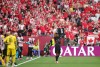 Canada's Nathan Saliba (25) holds up injured teammate Ismael Kone's jersey after scoring against Qatar during the second half of a World Cup Group B soccer match, in Vancouver, on Thursday, June 18, 2026. THE CANADIAN PRESS/Darryl Dyck