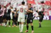 Qatar's Ayoub Aloui, left, and Canada's Jacob Shaffelburg embrace after Canada's victory in the World Cup Group B soccer match against Qatar in Vancouver, British Columbia, Thursday, June 18, 2026. (AP Photo/Abbie Parr)