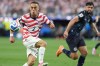 United States' Sergino Dest, left, controls a ball next to Paraguay's Omar Alderete during the World Cup Group D soccer match in Inglewood, Calif., near Los Angeles, Friday, June 12, 2026. (AP Photo/Jae C. Hong)