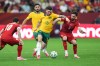 Australia's Aiden O'Neill (13) challenges for the ball with Turkey's Orkun Kokcu (6) during the World Cup Group D soccer match between Australia and Turkey in Vancouver, British Columbia, Saturday, June 13, 2026. (AP Photo/Abbie Parr)