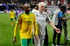 South Africa's Khuliso Mudau, left, and South Africa head coach Hugo Broos leave the pitch after the World Cup Group A soccer match between Czechia and South Africa in Atlanta, Thursday, June 18, 2026. (AP Photo/Erik S. Lesser)