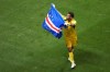Cape Verde goalkeeper Vozinha (1) waves a flag for fans after a 0-0 draw during the World Cup Group H soccer match between Spain and Cape Verde in Atlanta, Monday, June 15, 2026. (AP Photo/Jacob Kupferman)