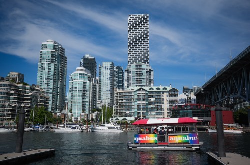 An Aquabus water taxi carrying tourists prepares to dock at Granville Island in Vancouver, B.C., Friday, Aug. 1, 2025. THE CANADIAN PRESS/Darryl Dyck