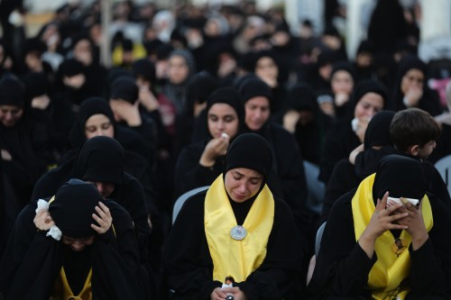 Women weep and mourn during a sermon marking the third day of Ashoura, the Shiite Muslim commemoration of the 7th-century death of Imam Hussein, the grandson of the Prophet Muhammad, in the southern port city of Tyre, Lebanon, Friday, June 19, 2026. (AP Photo/Hassan Ammar)