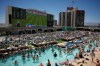 Fans watch a live broadcast of a World Cup soccer match between the U.S. and Australia from a pool at the Circa Resort & Casino, Friday, June 19, 2026, in Las Vegas. (AP Photo/John Locher)