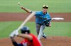 Milwaukee Brewers pitcher Jacob Misiorowski, right, delivers a pitch to Atlanta Braves' Matt Olson during the first inning of a baseball game, Friday, June 19, 2026, in Atlanta. (AP Photo/Erik S. Lesser)