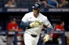 Tampa Bay Rays' Jonny DeLuca celebrates as he rounds the bases after his home run during the eighth inning of a baseball game against the Washington Nationals Friday, June 19, 2026, in St. Petersburg, Fla. (AP Photo/Jason Behnken)
