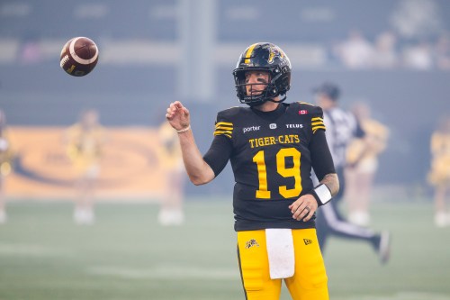 Hamilton Tiger-Cats' Bo Levi Mitchell (19) warms up ahead of CFL football action against the B.C. Lions in Hamilton on Friday, June 19, 2026. THE CANADIAN PRESS/Nick Iwanyshyn