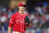Texas Rangers starting pitcher Jacob Degrom reacts between pitches to the San Diego Padres during the first inning of a baseball game, Friday, June 19, 2026 in Arlington, Texas. (AP Photo/Julio Cortez)