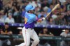 Colorado Rockies pinch-hitter Braxton Fulford follows the flight of his two-run double off Pittsburgh Pirates relief pitcher Mason Montgomery in the eighth inning of a baseball game Friday, June 19, 2026, in Denver. (AP Photo/David Zalubowski)