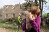 A woman holds her cat after it being found during search and rescue works in the damaged residential building following Russia's missile attack in Kharkiv, Ukraine, Saturday, June 20, 2026. (AP Photo/Andrii Marienko)
