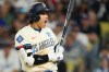 Los Angeles Dodgers' Shohei Ohtani reacts after a pitch was thrown in the dirt during the seventh inning of a baseball game against the Philadelphia Phillies, Saturday, May 30, 2026, in Los Angeles. (AP Photo/Mark J. Terrill)
