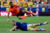 Netherlands' Cody Gakpo falls over Sweden's Gustaf Lagerbielke during the World Cup Group F soccer match between the Netherlands and Sweden in Houston, Saturday, June 20, 2026. (AP Photo/Ashley Landis)