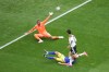 Germany's Kai Havertz (7) scores a goal against Curaçao goalkeeper Eloy Room (1) during the World Cup Group E soccer match between Germany and Curacao in Houston, Sunday, June 14, 2026. (AP Photo/Eric Smith)