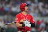 Texas Rangers' Jarred Kelenic heads to the dugout after an at-bat during the second inning of a baseball game against the San Diego Padres, Saturday, June 20, 2026, in Arlington, Texas. (AP Photo/LM Otero)