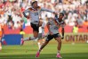 Germany's Nadiem Amiri leaps in the air as he celebrates after teammate Germany's Deniz Undav (26) scored their first goal during the World Cup Group E soccer match between Germany and Ivory Coast in Toronto, Saturday, June 20, 2026. (AP Photo/Stephanie Scarbrough)