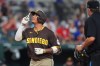 San Diego Padres' Manny Machado points up as he runs the bases after hitting a home run during the 10th inning of a baseball game against the Texas Rangers, Saturday, June 20, 2026, in Arlington, Texas. (AP Photo/LM Otero)
