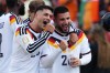 Germany's Nadiem Amiri (20) celebrates with Deniz Undav (26) after Undav's goal against Ivory Coast in stoppage time during the second half of a World Cup Group E soccer match in Toronto on June 20, 2026. THE CANADIAN PRESS/Frank Gunn