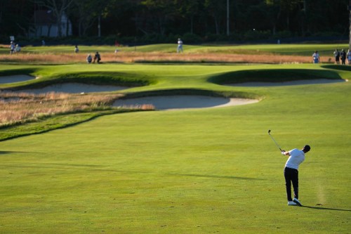 Wyndham Clark hits from the fairway on the 15th hole during the third round of the U.S. Open golf tournament at Shinnecock Hills Golf Club in Southampton, N.Y., Saturday, June 20, 2026. (AP Photo/George Walker IV)